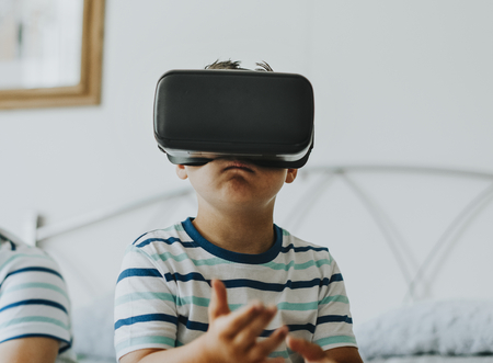 Boy playing with a VR headset
