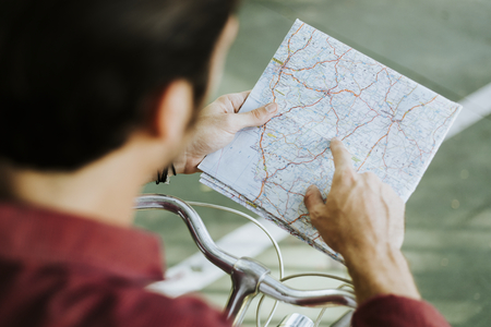 Cyclist checking on a map