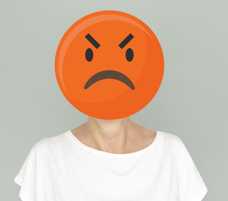 Foto de Angry face emoji portrait on a woman - Imagen libre de derechos