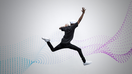 Black man jumping in to the air