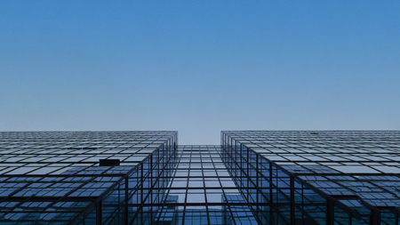 Glass building under the clear blue sky