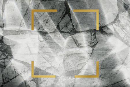 Golden framed square on a marble texture