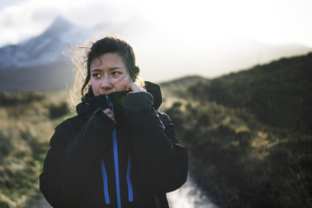 Woman on a road in Glen Etive, Scotland