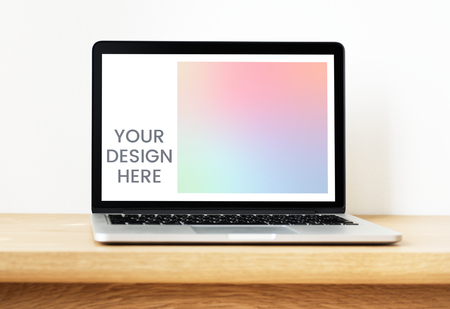 Laptop mockup on a wooden table