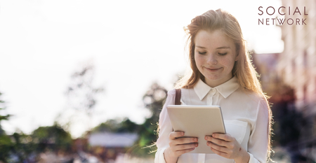 Young woman is using a digital tablet