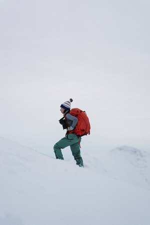 Woman hiking on a snowy mountain
