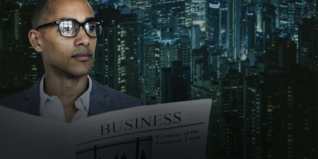 African Descent Business Man Newspaper Concept