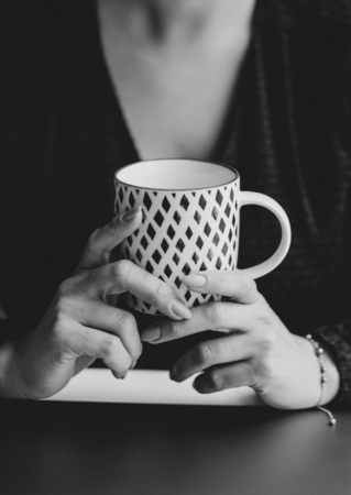 Woman holding a ceramic mug