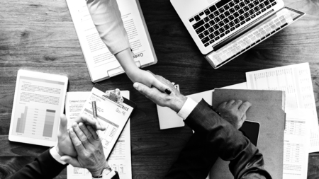 Business people shaking their hands