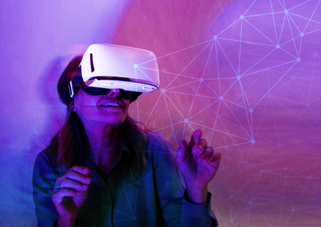 Cheerful woman enjoying a VR headset
