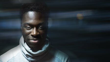 Happy black man wearing a turtle neck top