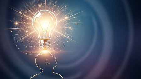 Idea concept with glowing light bulb and human head on blue backgroundの素材
