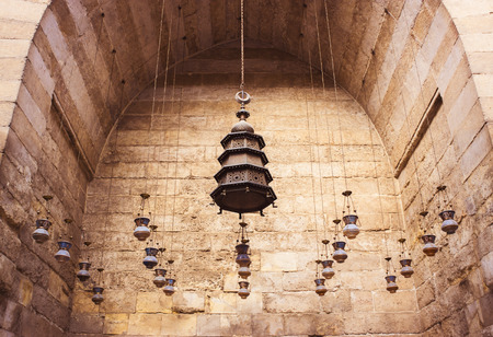 Group of lanterns hanging from the ceiling in old mosques in Cairoの写真素材