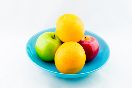 Two kinds of fruit on a plate in whiteの写真素材