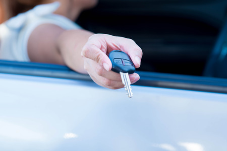 giving a car keyの写真素材