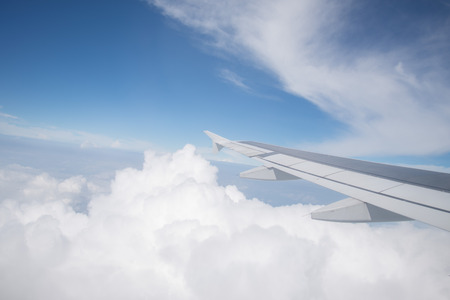 Wing of an airplane flying in the sky so beautiful.の写真素材