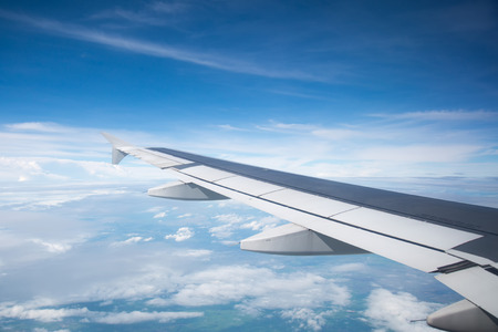 Wing of an airplane flying in the sky so beautiful.の写真素材