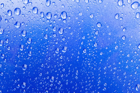 water drops on the blue carの写真素材
