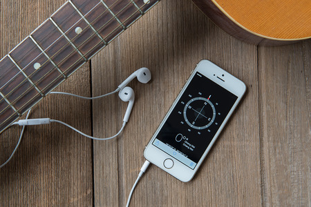 JUNE 23, 2015:Apple iphone 5s displaying Compass application.のeditorial素材