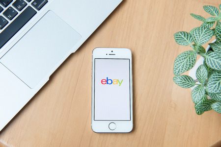 CHIANGMAI, THAILAND - June 24, 2015:iPhone opened to Ebay homepage. Ebay, an online auction and shopping site, was founded in 1995.のeditorial素材