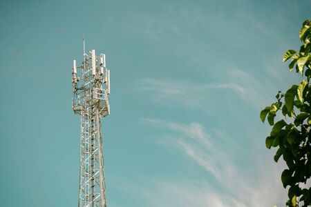 GSM cell transmission station and summer landscape with cloudy sky,Cellulartower,Telecommunications equipmentの写真素材