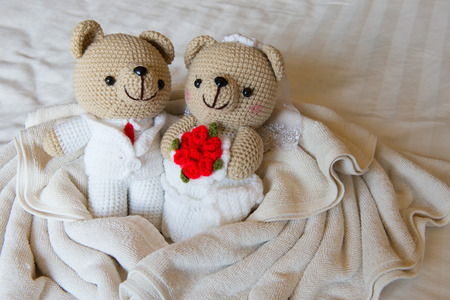 bear doll in love, Toy bears with wedding, two teddy bears on the bed.の写真素材