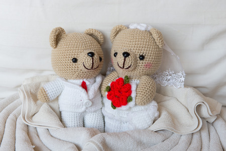 bear doll in love, Toy bears with wedding, two teddy bears on the bed.の写真素材