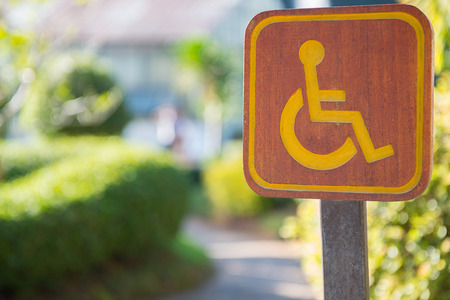 cripple sign wood label in gardenの写真素材