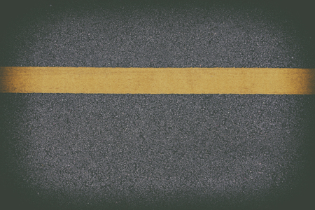roadbackground,Highway surface with two yellow lines. Asphalt backdropの写真素材