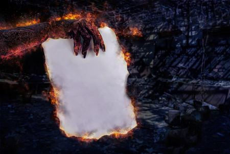 Hand zombie holding of paper fire burning . Subject halloween, halloween team.の写真素材