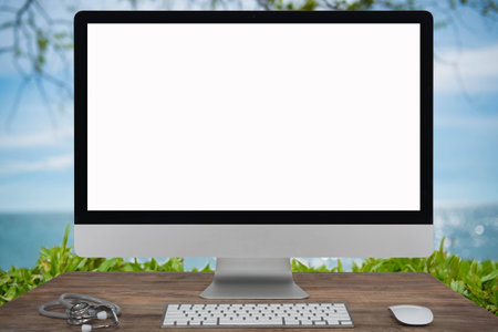 Computer Keyboard and mouse with summer white sand beach with sparkling sea water