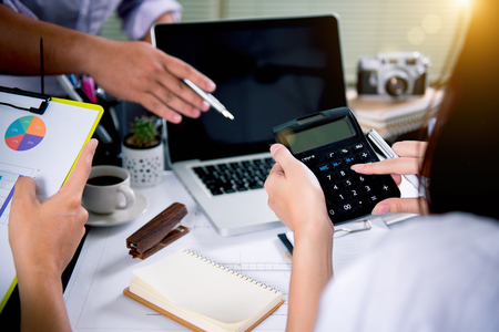 Business team meeting. Photo professional investor working new start up project. Finance task.Digital tablet docking keyboard laptop computer smart phoneの写真素材