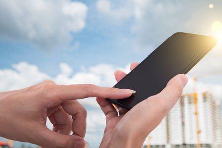 Using woman his mobile office, close upの写真素材