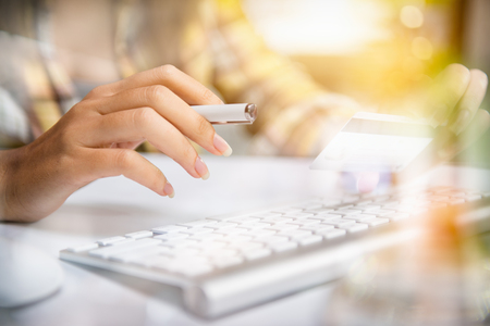 Young businesswoman hand with mobile network communication technology, wireless internet application development Multichannel online banking payment communication network digital technologyの写真素材