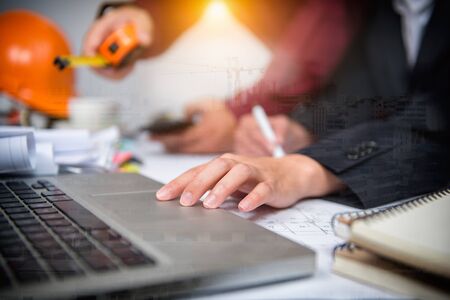 Cooperation Corporate Achievement Planning Teamwork ConceptClose-up Of Person's engineer Hand Drawing Plan On Blue Print with architect equipment.の写真素材