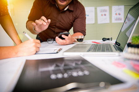 Business team meeting. Photo professional investor working new start up project. Finance task.Digital tablet docking keyboard laptop computer smart phone using, filter film effectの写真素材