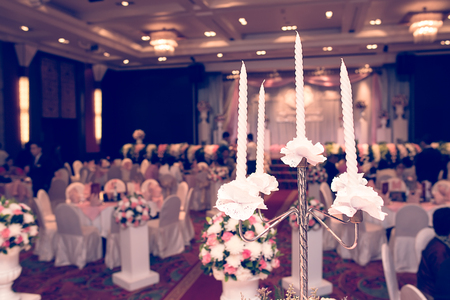 Vintage Wedding Flowers with a wedding ceremony in backgroundの写真素材