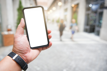 Man holding smart phone with blurred background. For Graphic display montage.with copy space.の写真素材