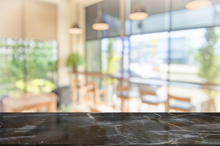 black marble table top on blur coffee shop window background. For product or foods montage.の写真素材