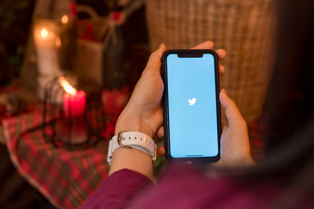CHIANGMAI, THAILAND - JAN 16,2018:iphone X open Twitter application,Twitter is an online social networking and microblogging service that enables users to send and read "tweets"のeditorial素材