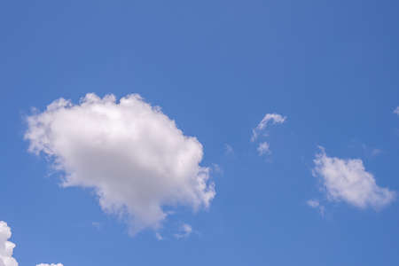 Beautiful blue clear sky background with tiny cloudsの写真素材