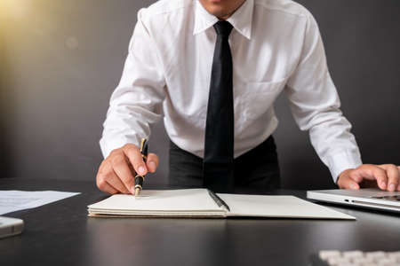 Business and banking concept close up business man signing contract making a deal.の写真素材