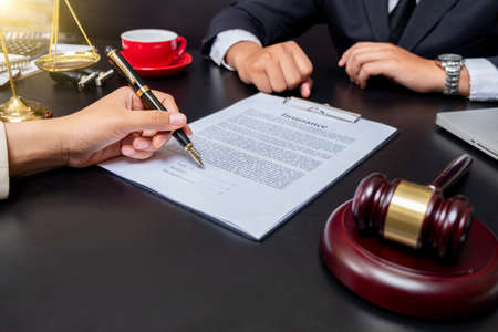 Businessman close up and Male lawyer or judge consult having team meeting with client, Law and Legal services concept.の写真素材