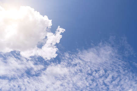 Beautiful blue clear sky background with tiny cloudsの写真素材