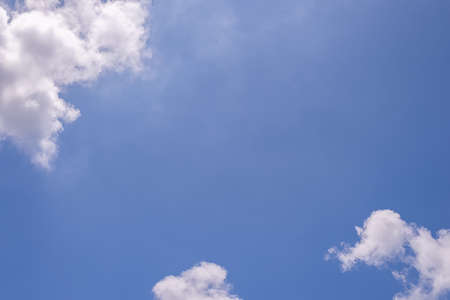 Beautiful blue clear sky background with tiny cloudsの写真素材