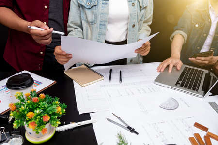 Cooperation Corporate Achievement Planning Design Draw Teamwork Concept, close-up Of Person's engineer Hand Drawing Plan On Blue Print with architect equipment.の写真素材