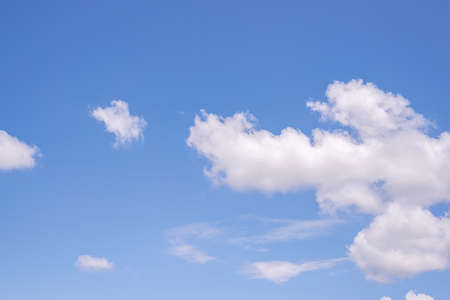 Beautiful blue clear sky background with tiny cloudsの写真素材