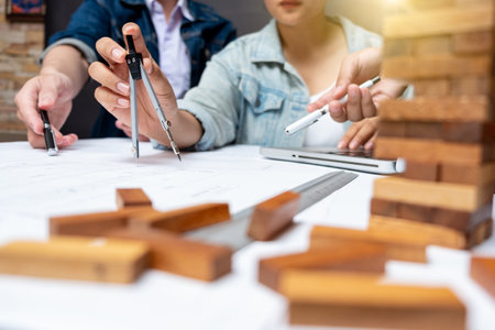 Cooperation Corporate Achievement Planning Design Draw Teamwork Concept, close-up Of Person's engineer Hand Drawing Plan On Blue Print with architect equipment.の写真素材