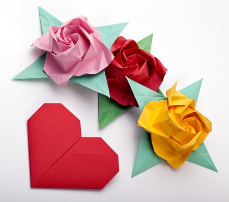 Origami a multi colored roses, green leaves and red heartの写真素材