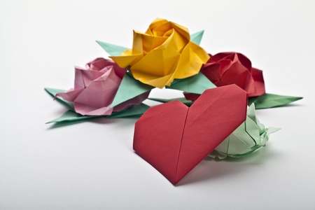 Origami a multi colored roses, green leaves and red heartの写真素材
